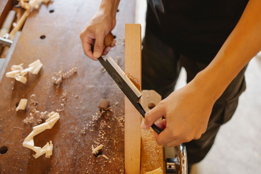 Timber being shaped with a hand plane
